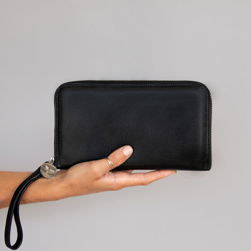 Zip Around Wallet in Black  front in hand