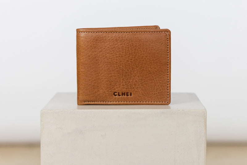 Brown leather wallet with 'CLHEI' branding on a white cube against a white background