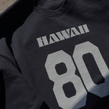 Black sweatshirt with 'HAWAII 80' printed on it