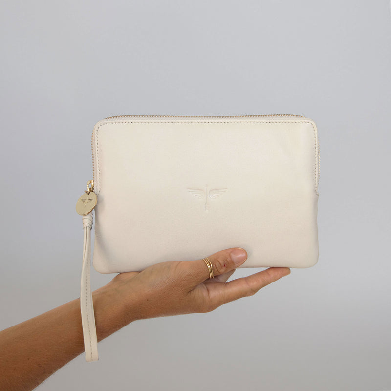 Pouch Wallet in Creme, holding photo
