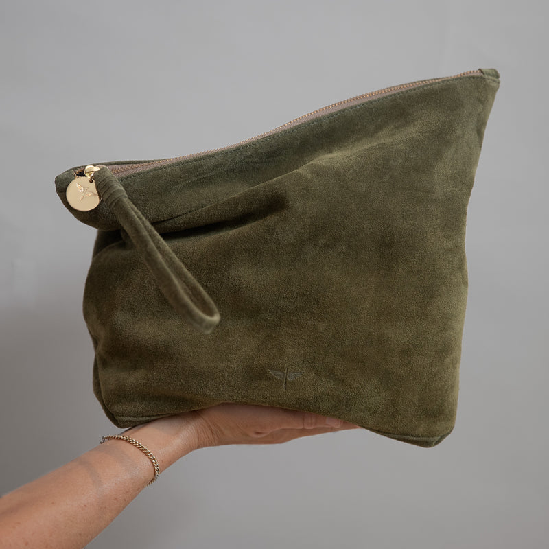 Rio clutch in Olive suede in models hand